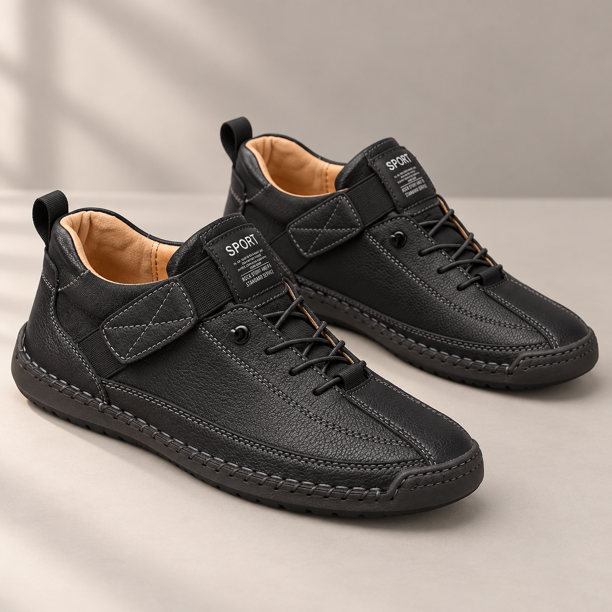 Black Elara shoes on a neutral studio surface, showing the adjustable strap and stitched sole